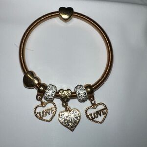 Gold Tone Coil Heart and Crystal Charm Bracelet
